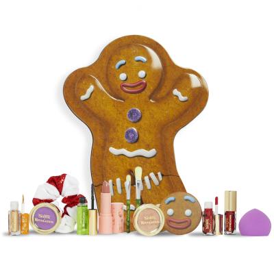 Makeup Revolution London Shrek Gingy 12 Days Advent Calendar Ajándékcsomagok szemhéjfesték 2 db + highlighter 1 db + szájfény 2 db + rúzs 1 db + pirosító 1 db + szemöldökgél 1 db + sminkecset 2 db + sminkszivacs 1 db + sminktükör 1 db + hajgumi 1 db