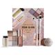 Makeup Revolution London Pink Glow Gift Set Ajándékcsomagok Mini Reloaded Palette szemhéjfesték paletta 4,2 g + Shimmer Bomb szájfény 4,5 ml Glimmer Nude + Viva Loose Body Glitter csillámok 3 g Partaay Gold + Balm Glow multifunkciós balzsam arccsontra, szemre éa ajakra 8,2 g Natural Nude + sminksziv